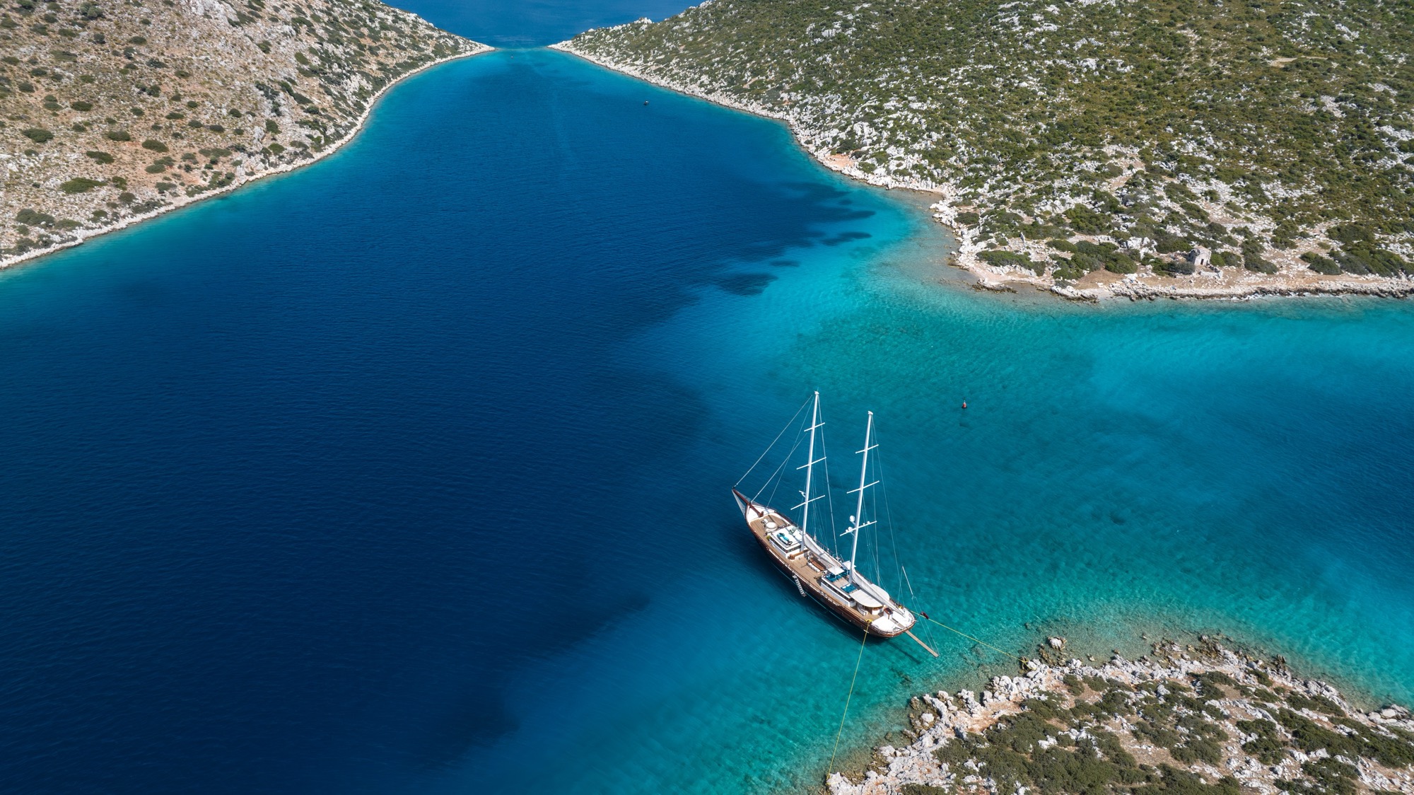 Mare Nostrum at anchor in a bay